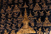 Wat Xieng Thong temple in Luang Prabang, Laos. The facade of the sim decorated with gold stencilling on a black lacquer background. 